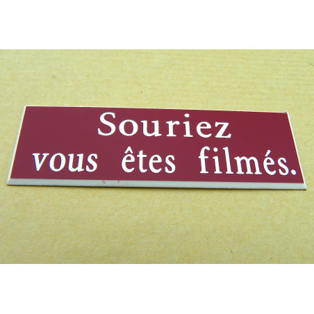 étiquette adhésive "souriez vous êtes filmés" multicolores