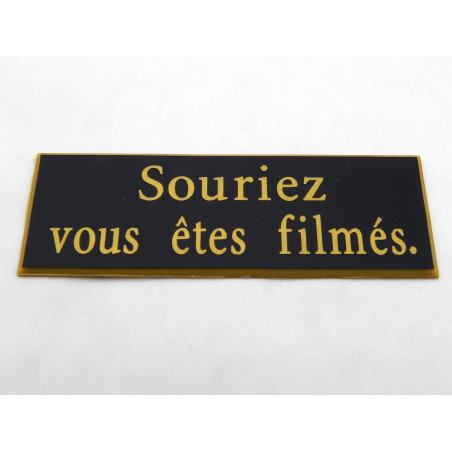 étiquette adhésive "souriez vous êtes filmés" multicolores
