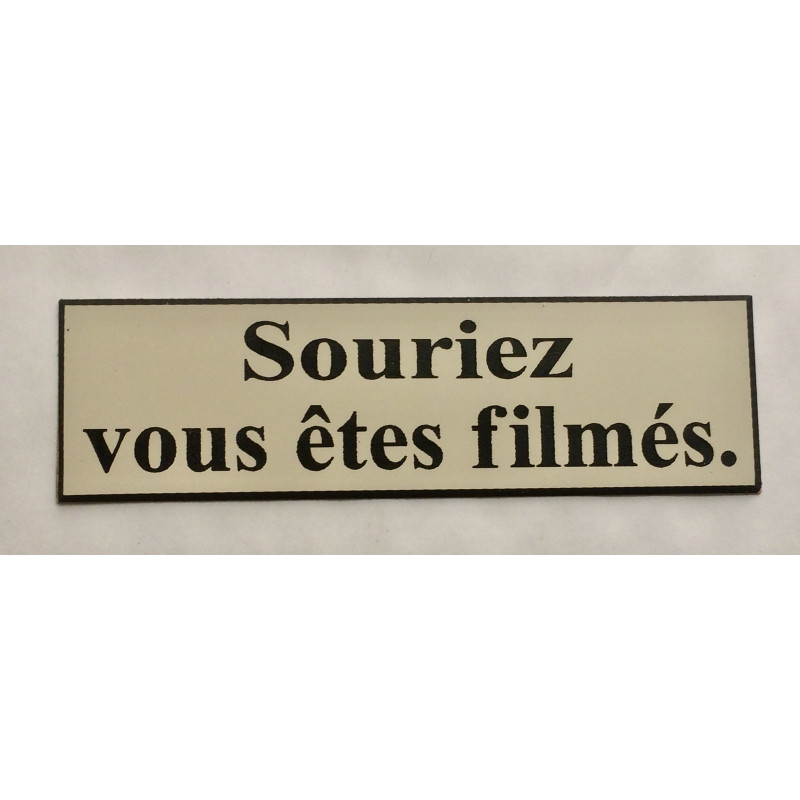 étiquette adhésive "souriez vous êtes filmés" multicolores
