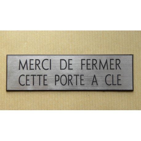 plaque adhésive "MERCI DE FERMER CETTE PORTE A CLE" argentée format 50 x 150 mm