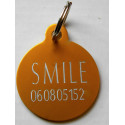 Médaille gravée "motifs pattes" orange pour Chien gravure 1 face Ft 32 mm