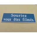 plaque adhésive "souriez vous êtes filmés" bleu