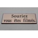 plaque adhésive "souriez vous êtes filmés" cuivre